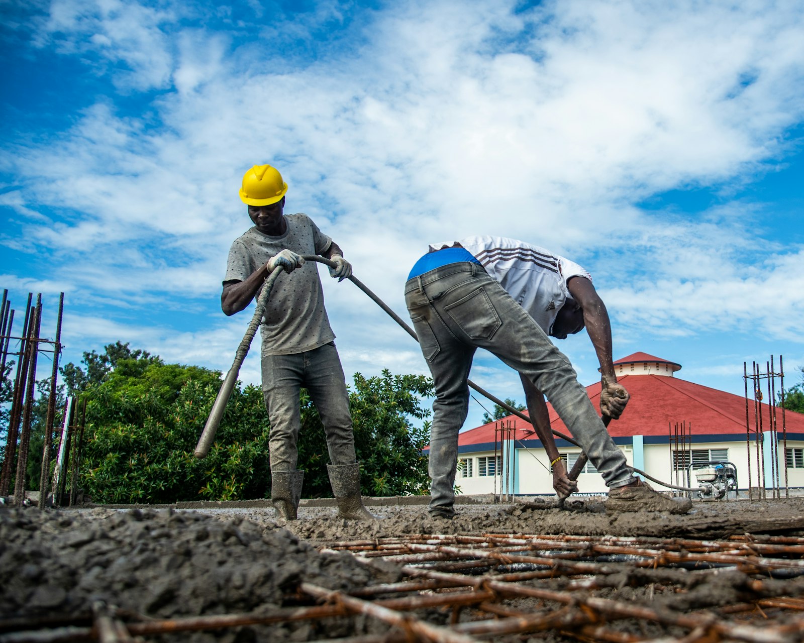 Crew screeding a concrete slab